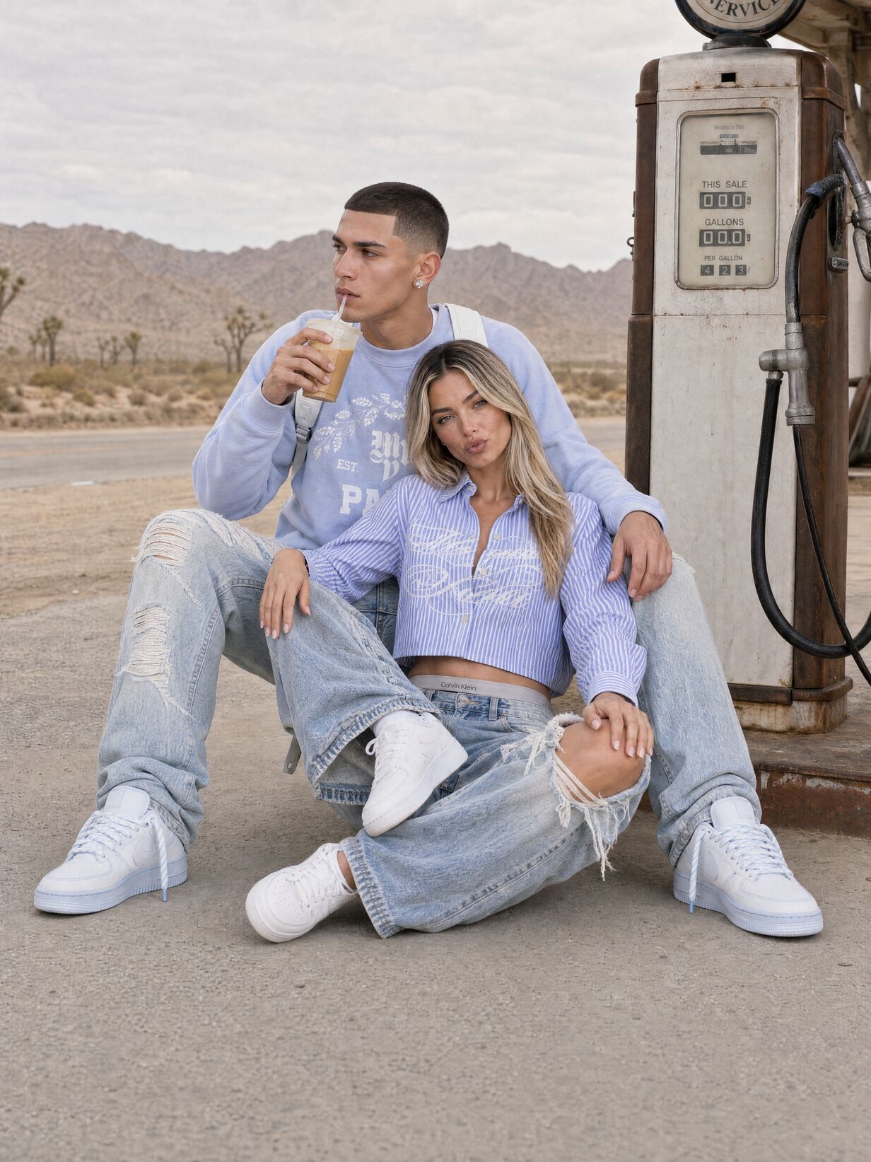 Editorial campaign still: two models seated at a desert filling station.